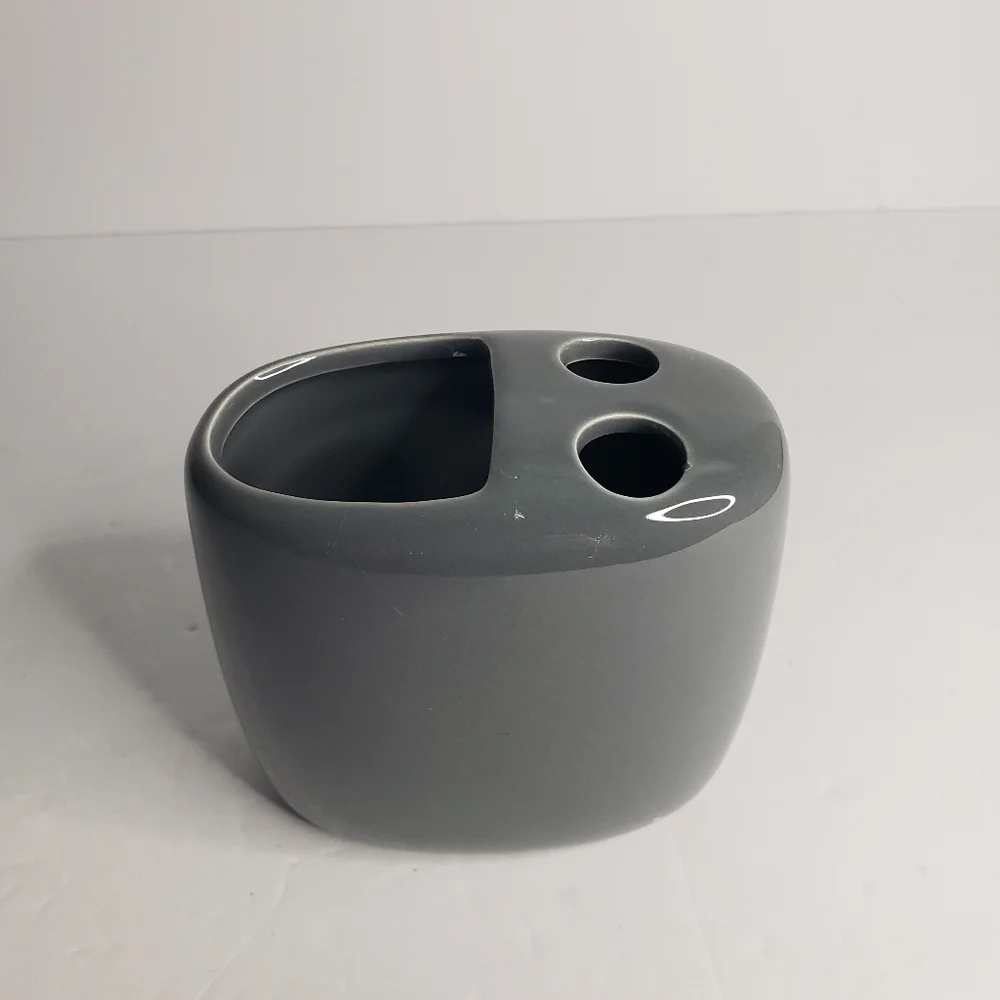 Ceramic toothbrush and toothpaste holder. 171